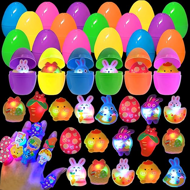 Colorful toy eggs with LED lights and small toys inside on a black background