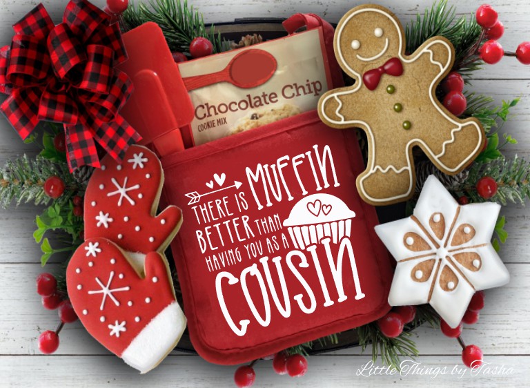 Red cookie tin with gingerbread-themed cookies and decorative elements on a wooden surface.