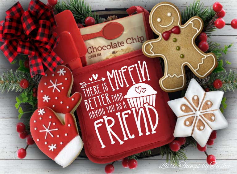 Red cookie tray with gingerbread cookies and a decorative bow on a wooden surface.