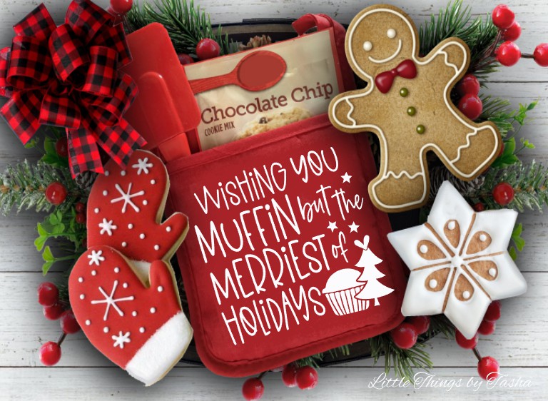 Decorative cookie set with a red tin, gingerbread cookies, and Christmas decorations on a wooden surface.
